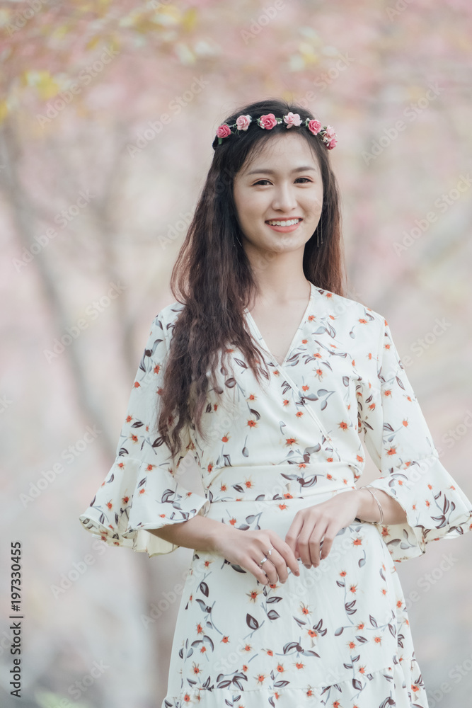 Portrait of attractive Asian teenage girl around the age of 18-25 years amid pink flower garden. Portrait of attractive Asian teenage girl around the age of 18-25 years amid pink flower garden.