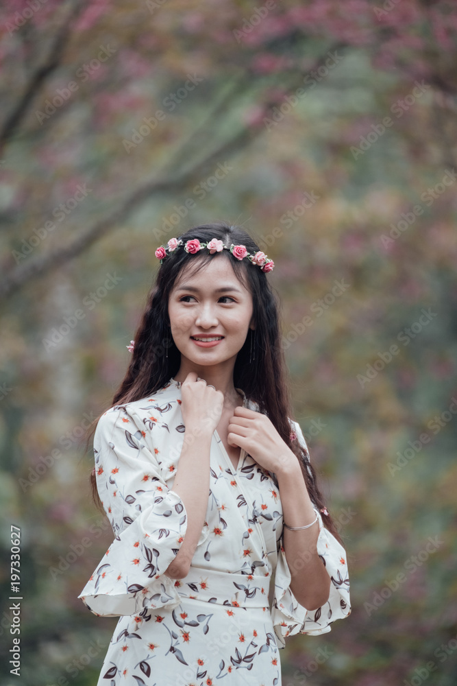 Portrait of attractive Asian teenage girl around the age of 18-25 years amid pink flower garden. Portrait of attractive Asian teenage girl around the age of 18-25 years amid pink flower garden.