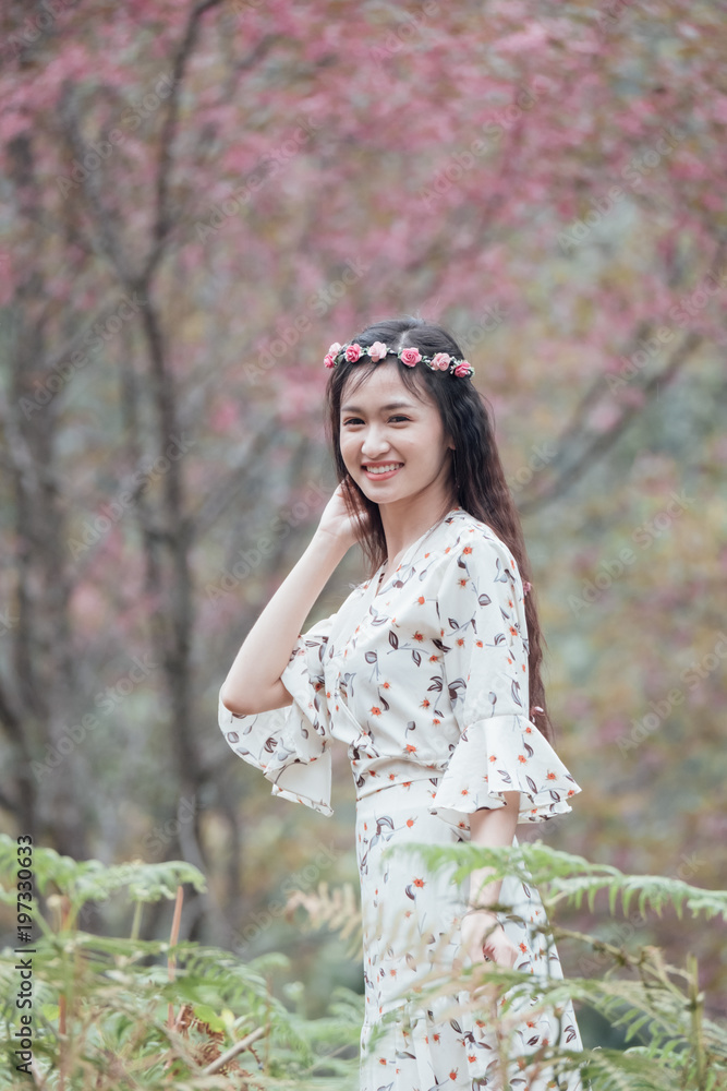 Portrait of attractive Asian teenage girl around the age of 18-25 years amid pink flower garden. Portrait of attractive Asian teenage girl around the age of 18-25 years amid pink flower garden.