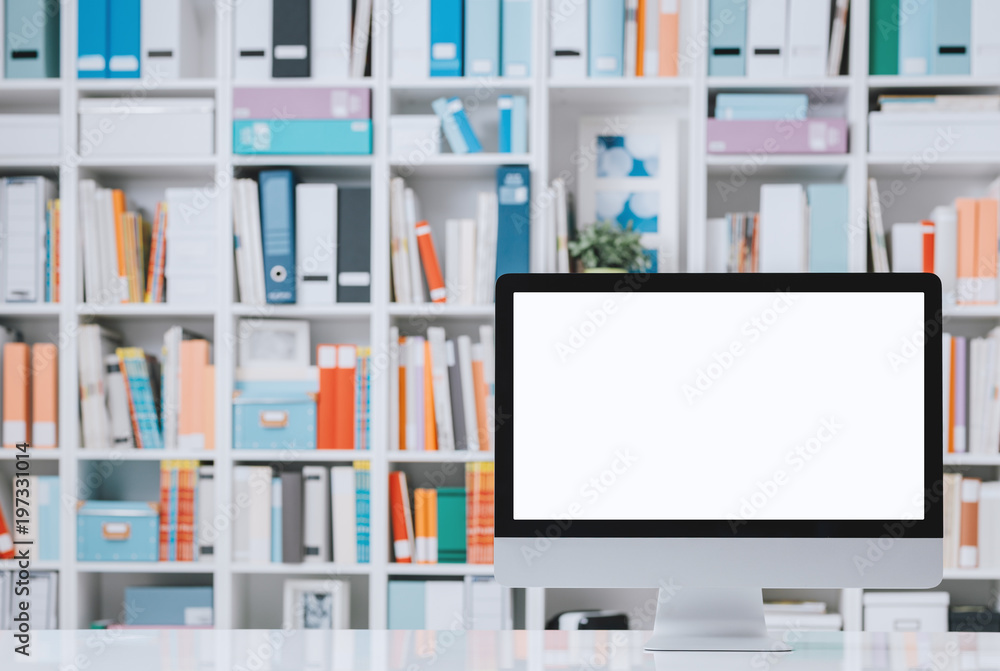 Professional workspace with computer and shelves