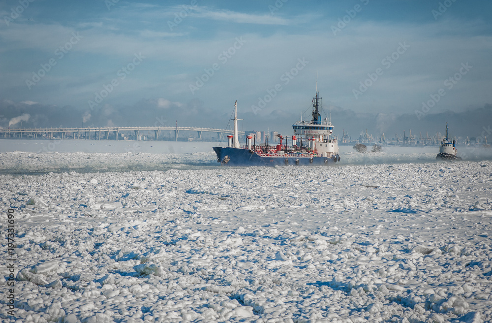Ship going through the ice sea.  Winter fairway