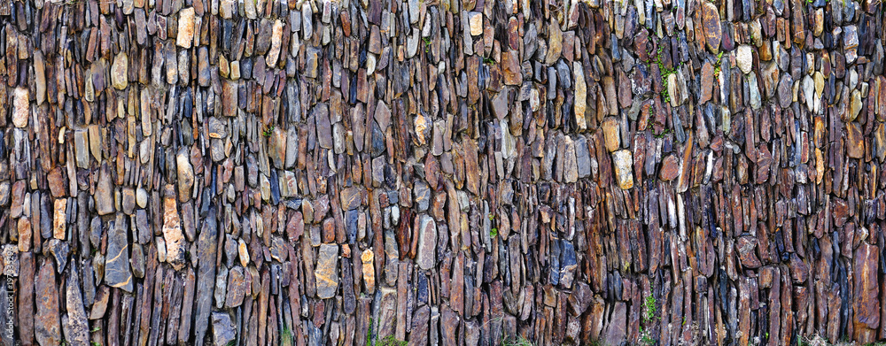 Fototapeta premium Panoramic vertical stones wall