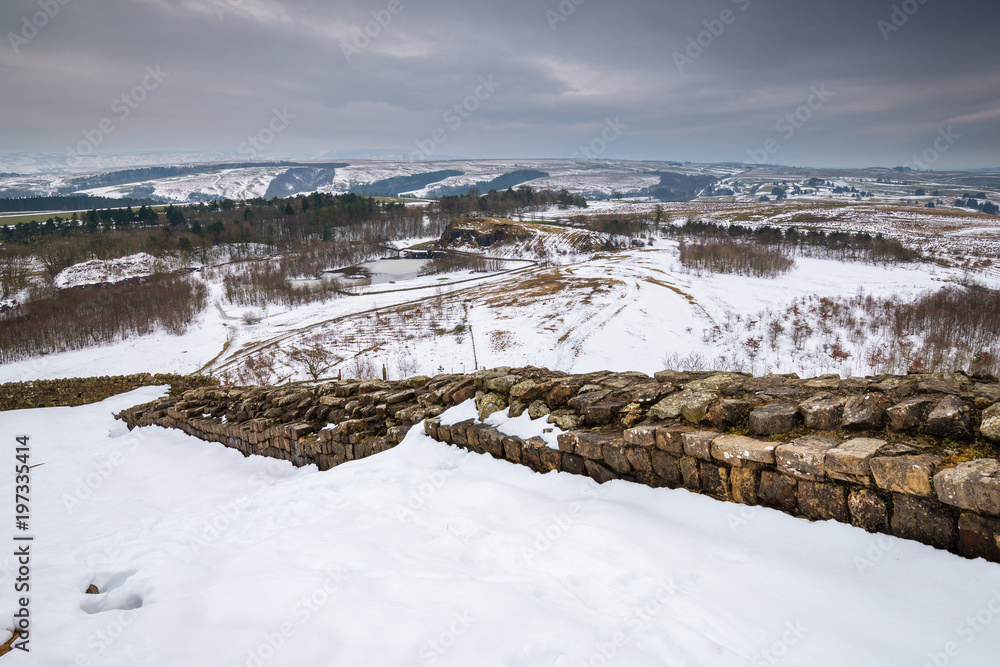 Winter snow on Hadrian's Wall above Walltown Quarry /being a World Heritage Site in the beautiful Northumberland National Park. Popular with walkers along the Hadrian's Wall Path and Pennine Way Winter snow on Hadrian's Wall above Walltown Quarry /being a World Heritage Site in the beautiful Northumberland National Park. Popular with walkers along the Hadrian's Wall Path and Pennine Way
