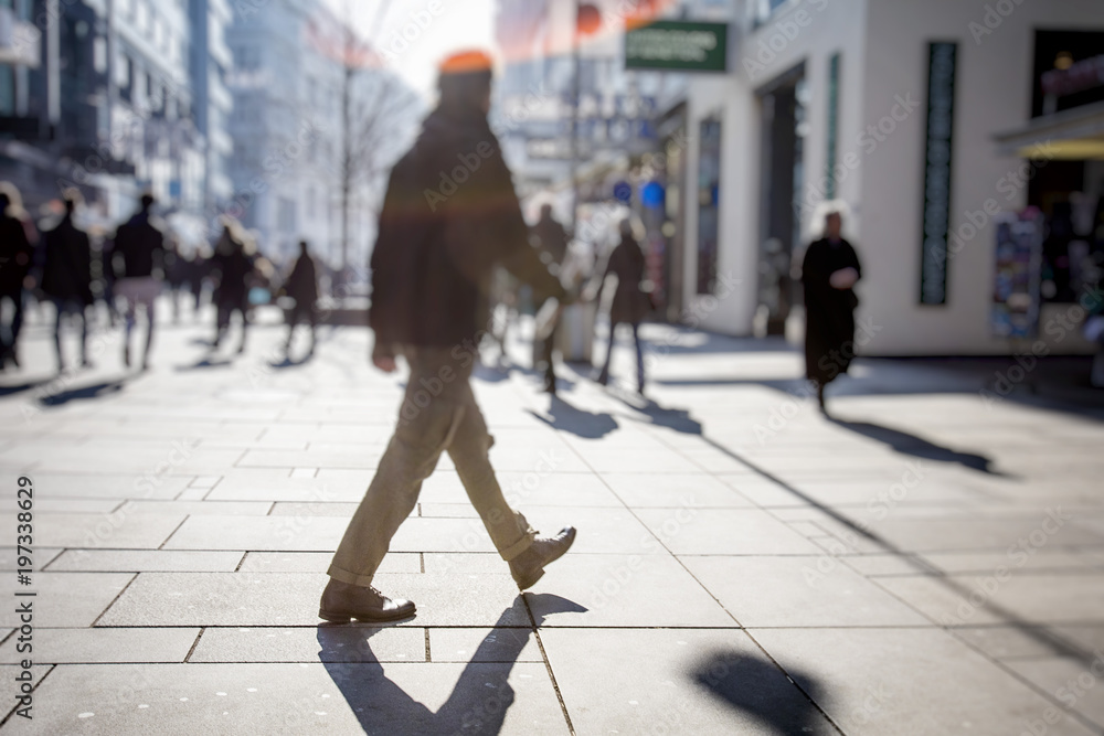 Fototapeta premium people walking on city streets