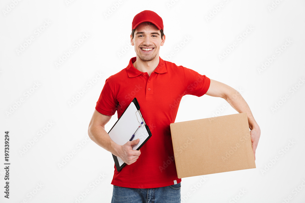 Happy young delivery man with parcel post box Happy young delivery man with parcel post box