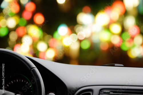 Abstract blurred background in front of the car. © singkamc
