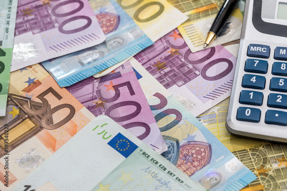 euro with pen and calculator. close up euro with pen and calculator. close up