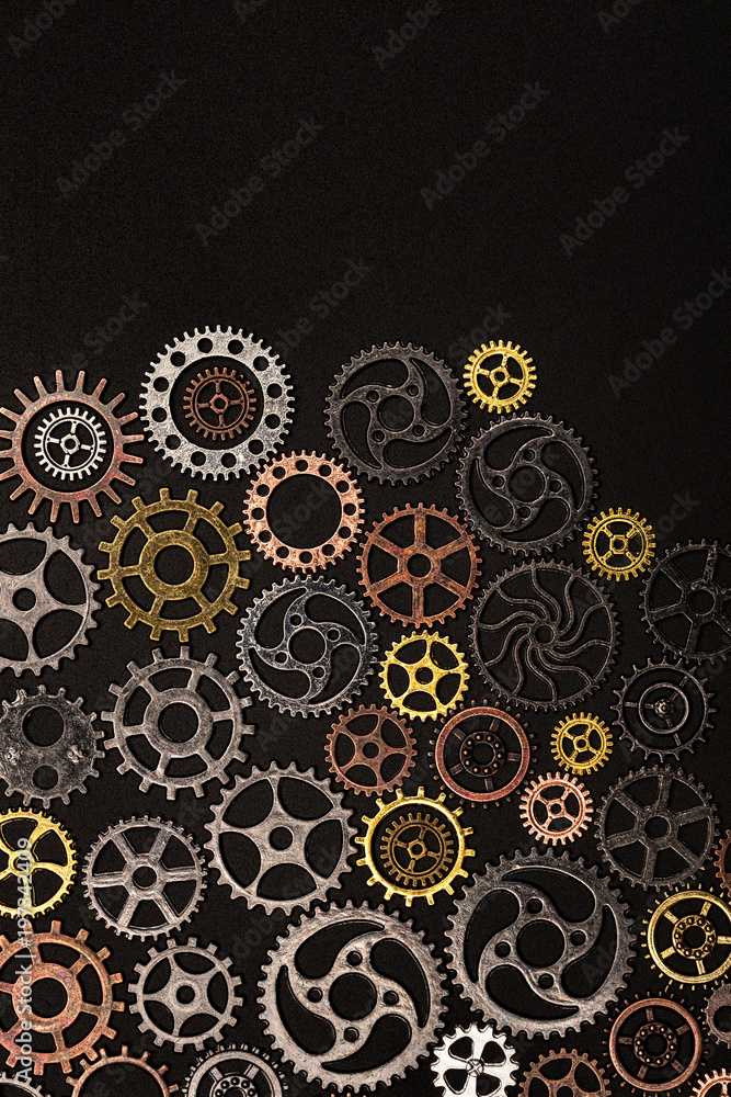 Bunch of cogwheels on a black background.