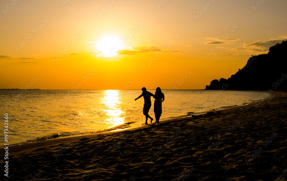wedding couple in beautiful at sunset by the sea.