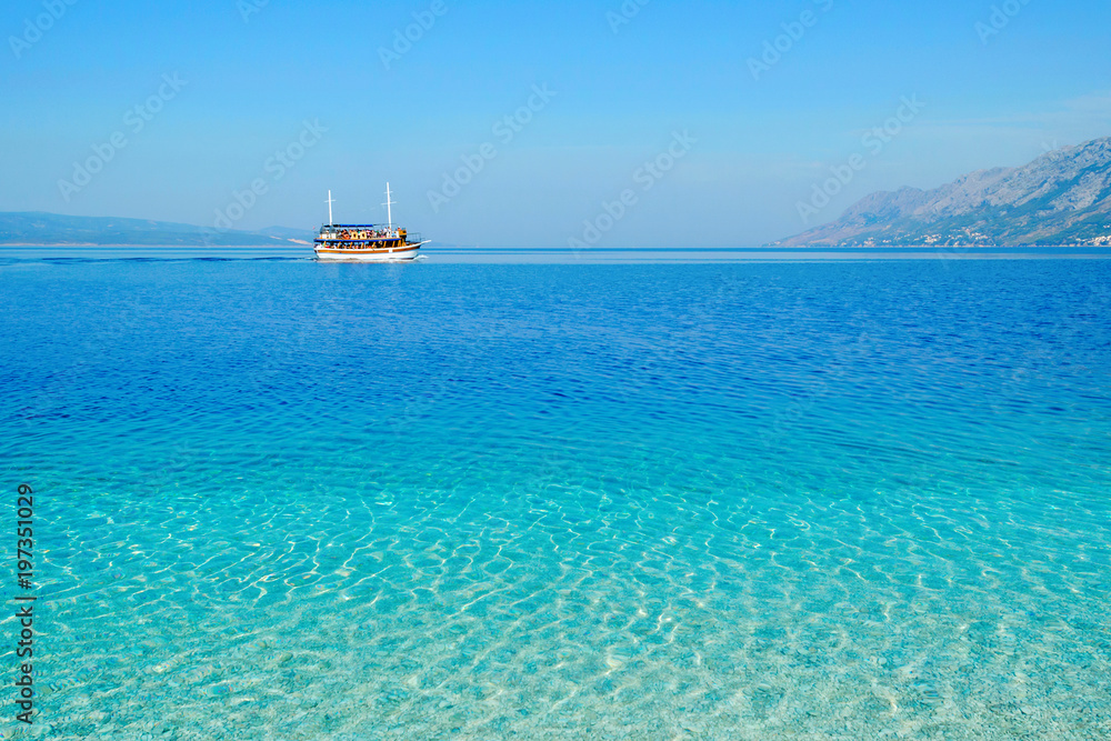 view of adriatic sea with a boat, Croatia in summer