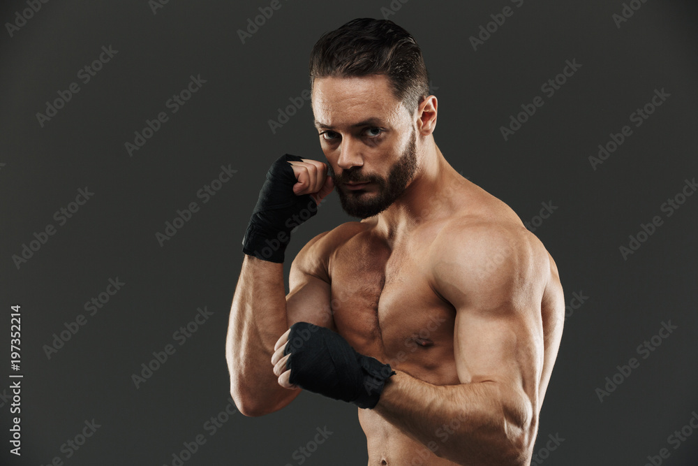 Portrait of a confident shirtless muscular sportsman