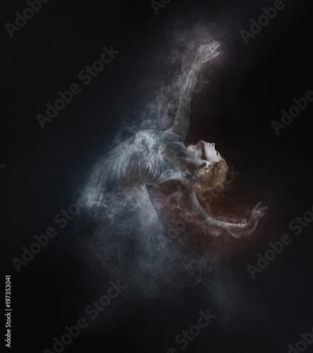 Dancer from smoke on the dark background © Andrii IURLOV