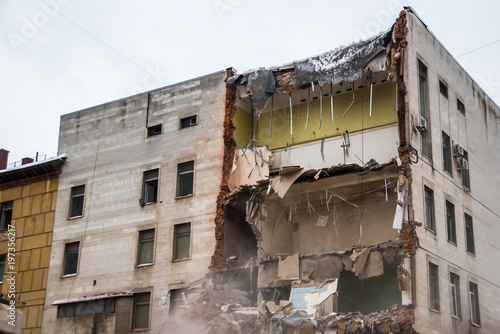 Demolition of a building with floors fragment. Destroyed structure, broken floors.