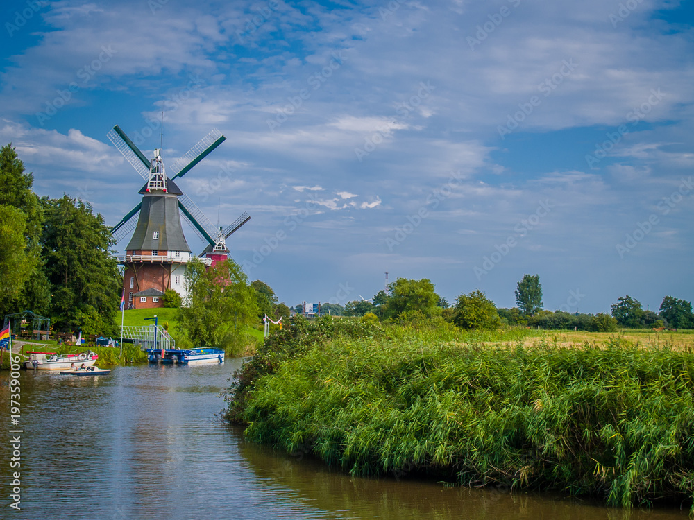 Windmill and Canal near Greetsiel, Germany