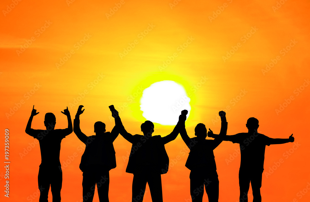 They are standing and show hand together.They are enjoying and also they are watching the evening glow together. They are happy in good time.Photo concept for Silhouetted and team work. They are standing and show hand together.They are enjoying and also they are watching the evening glow together. They are happy in good time.Photo concept for Silhouetted and team work.
