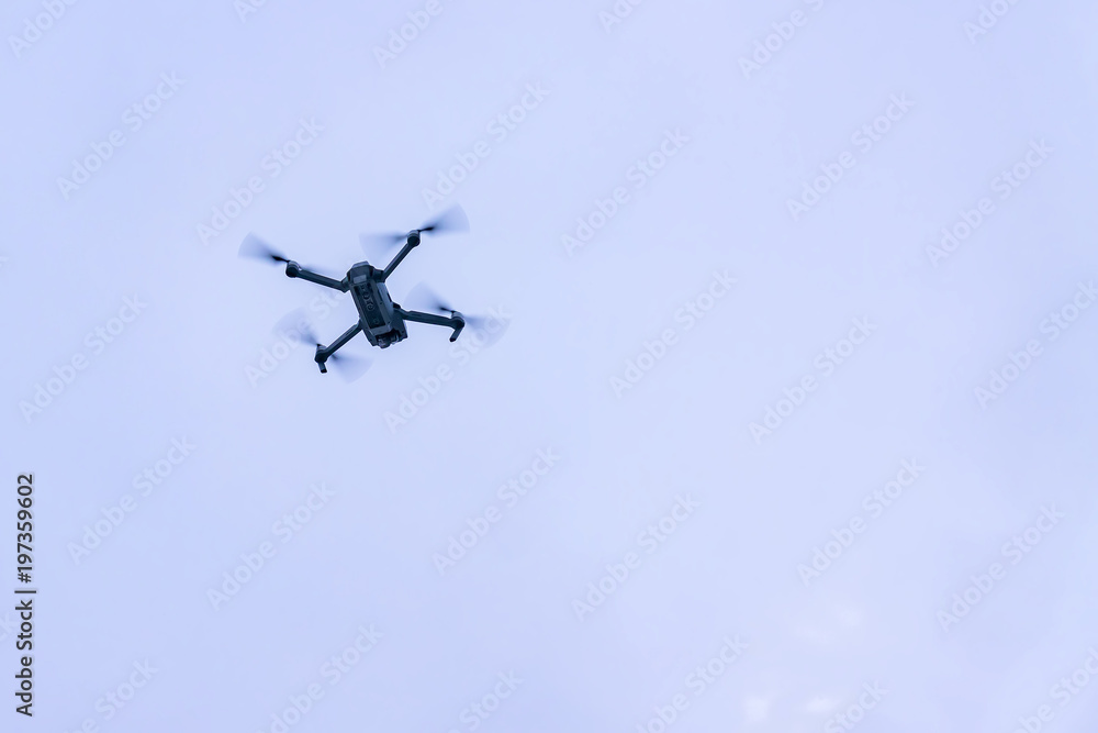 flying drone against blue sky flying drone against blue sky