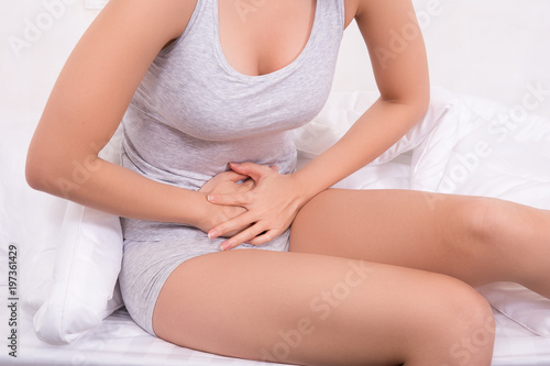 Young women have menstrual cramps.