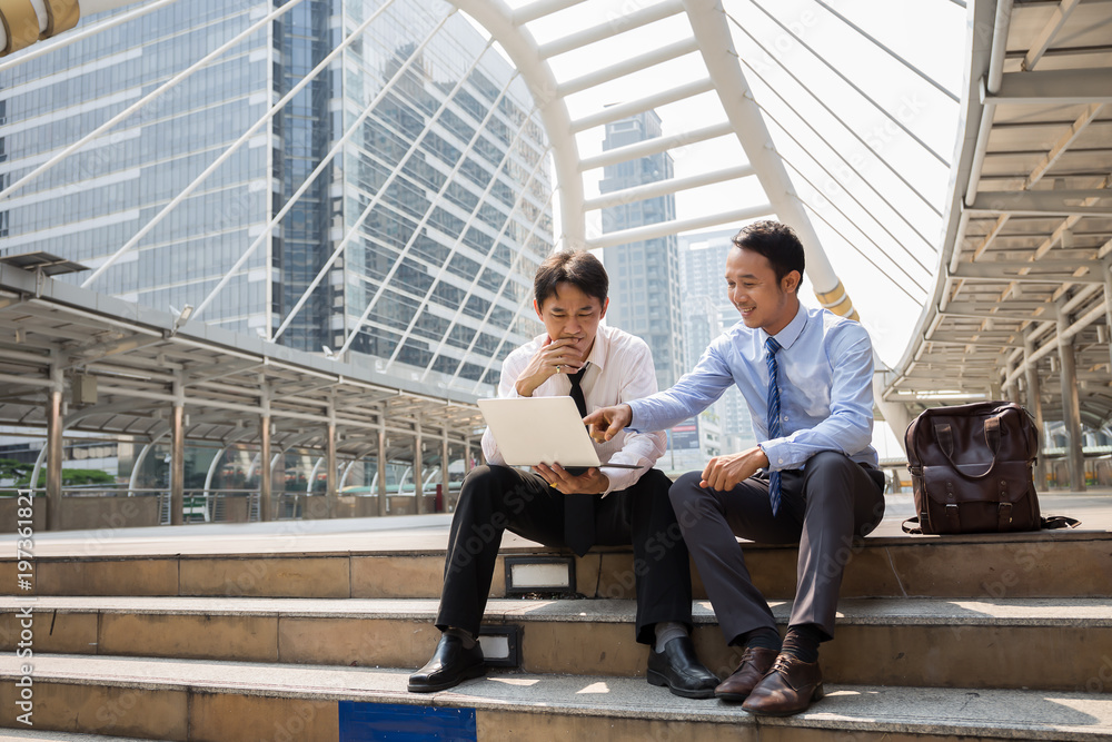 Two businessman are working with smart phone and notebook for business concept. Two businessman are working with smart phone and notebook for business concept.