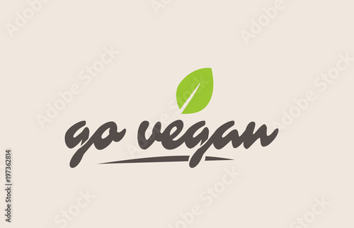 go vegan word or text with green leaf. Handwritten lettering suitable