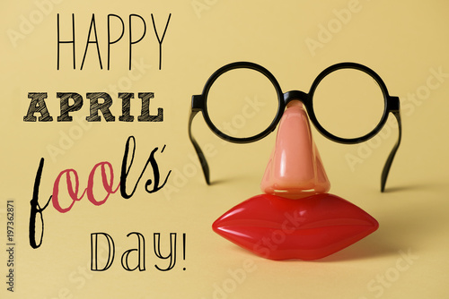 novelty glasses and text happy april fools day