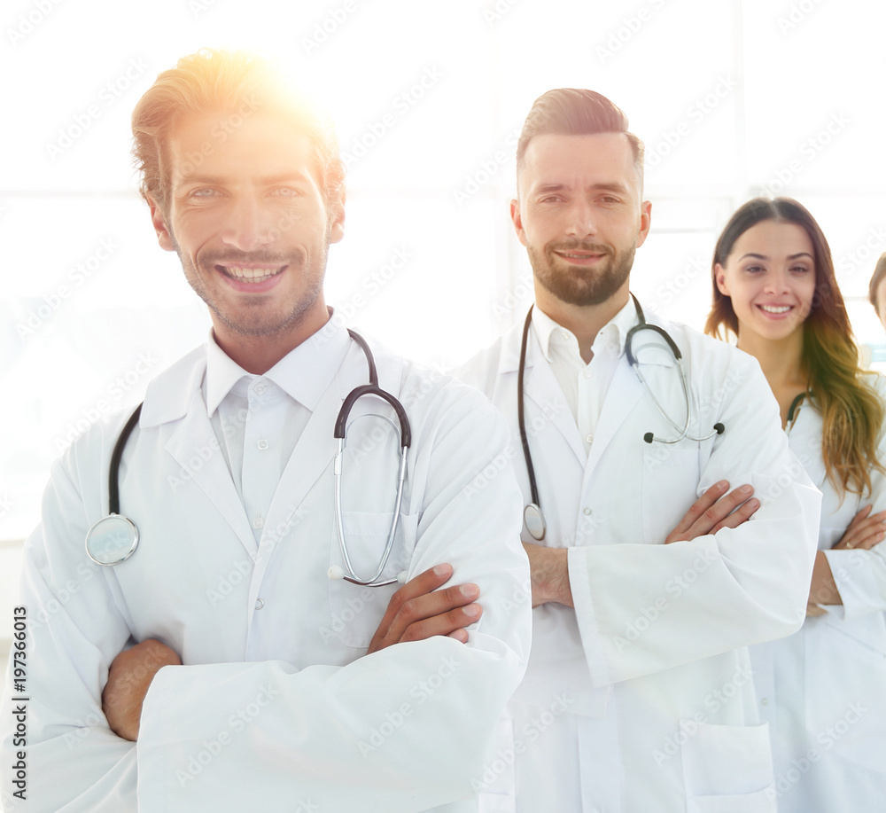 Portrait of medical team standing with arms crossed in hospital Portrait of medical team standing with arms crossed in hospital
