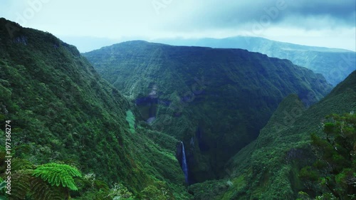 4K tropical island Nature timelapse. Clouds & rays of sun moving fast over tropical forest. Trou de Fer, La Réunion