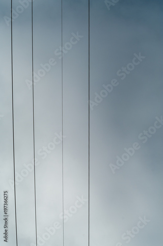 Wires and the cloudy sky