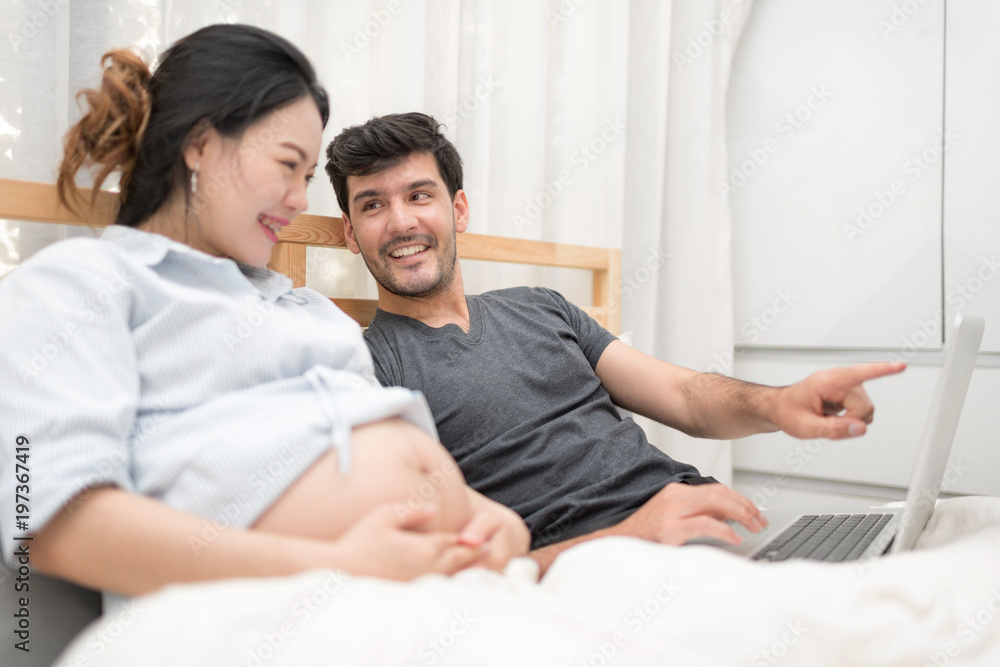 In Selective Focus Of Happy Family Checking New Baby In The Morning.Close Up Of A Beautiful Happy Pregnant Woman With Big Belly. Pregnancy And Motherhood Moment People And Expectation Concept. In Selective Focus Of Happy Family Checking New Baby In The Morning.Close Up Of A Beautiful Happy Pregnant Woman With Big Belly. Pregnancy And Motherhood Moment People And Expectation Concept.