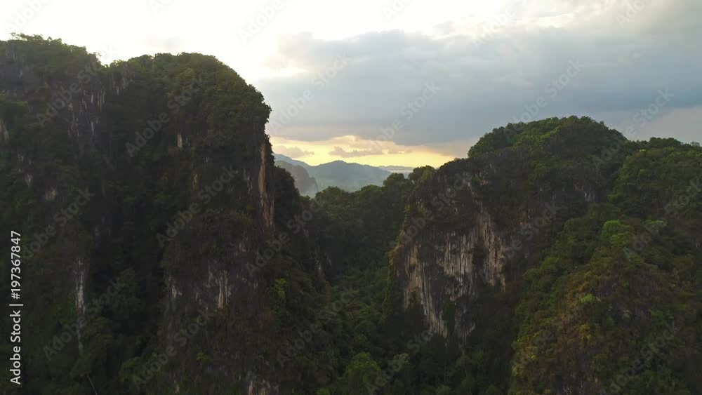 AERIAL. Fantastic view of morning mountains landscape. Flight above huge peaks in rain clouds. AERIAL. Fantastic view of morning mountains landscape. Flight above huge peaks in rain clouds.