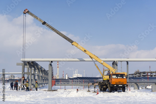 Truck crane and oil pipeline welding