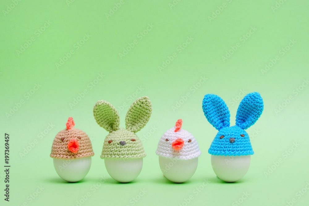 Easter holiday concept with cute handmade eggs, bunny, chicks on green background. Easter ideas 