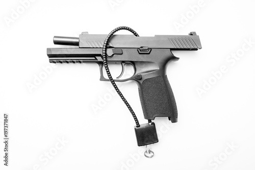 Obraz na płótnie Locked disarmed secured handgun white background w salonie