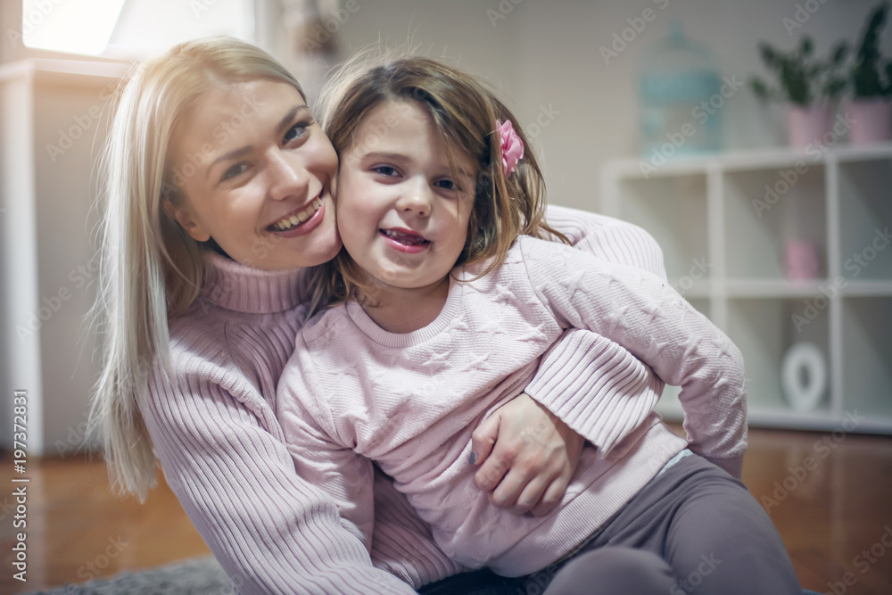 Portrait of mother and daughter at home. Portrait of mother and daughter at home.