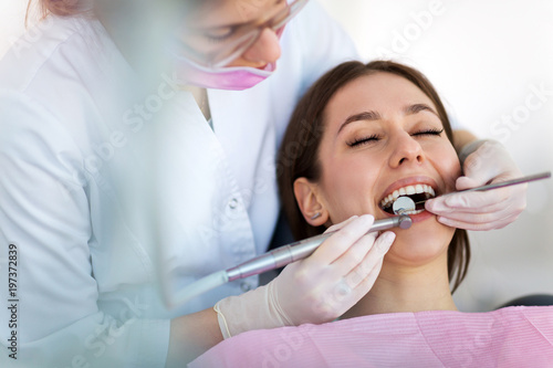 Dentist and patient in dentist office  