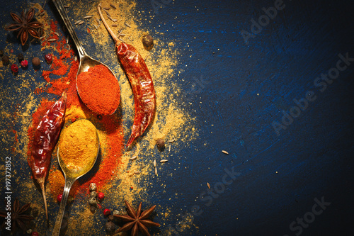 Fototapeta Naklejka Na Ścianę i Meble -  Wooden table of colorful spices