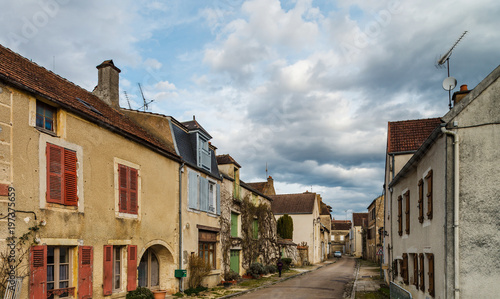 Old medieval houses on the cobbled street in ancient french village Noyers