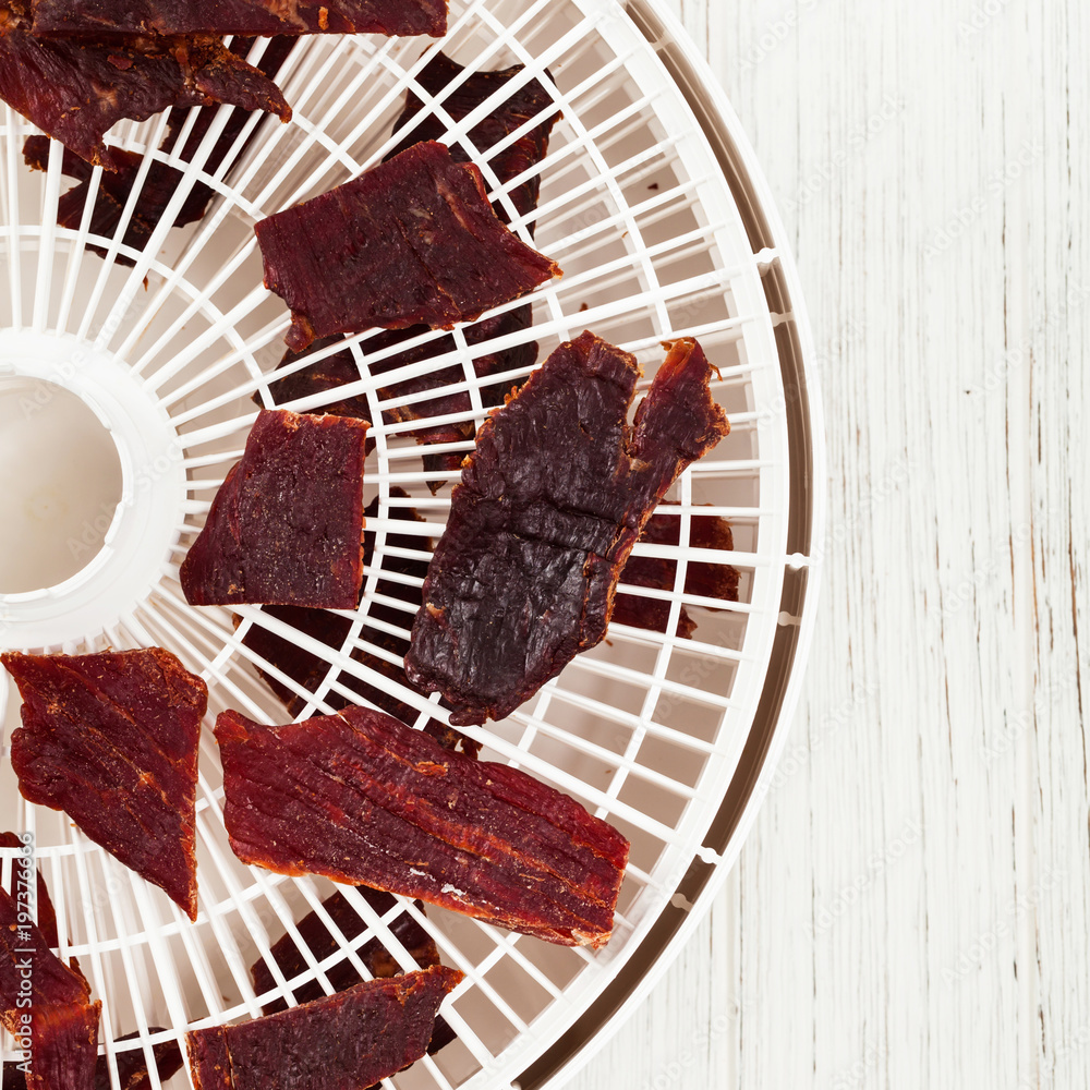 Homemade Beef Jerky in a Dehydrator. Selective focus. Stock Photo | Adobe  Stock