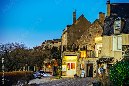 Narrow street in old french city Vezelay, evening time