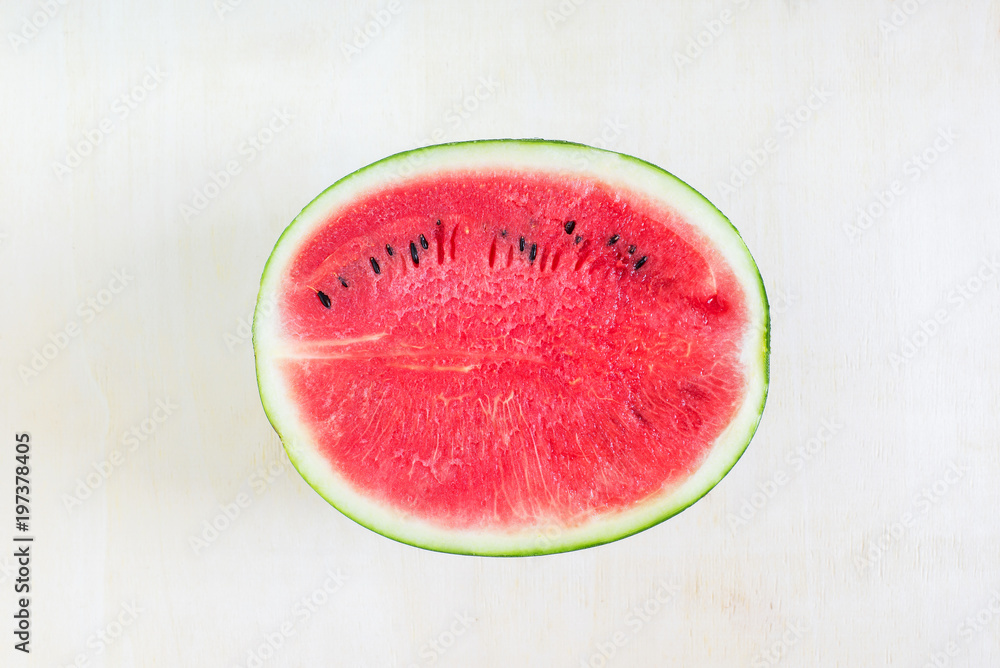Watermelon cut half on wooden table Watermelon cut half on wooden table