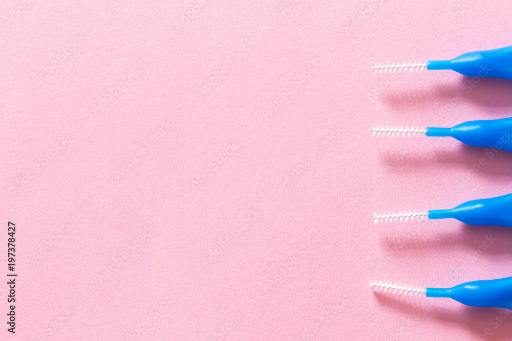 Brushes for braces, toothbrushes for interdental spaces on pink