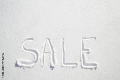 Handwritten inscription on pure white snow - sale.