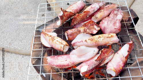 Cooking is squid BBQ grill food menu on grille charcoal strove