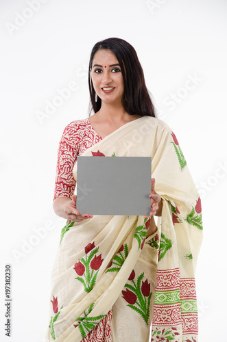 Indian woman in a sari with a message board photo