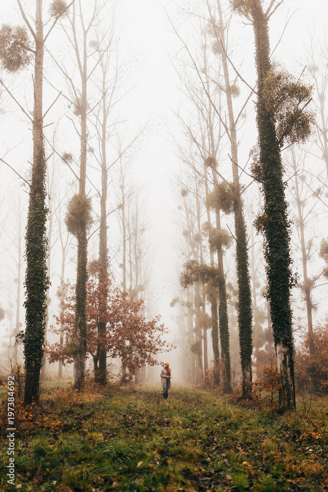 Pretty woman in foggy forest Pretty woman in foggy forest