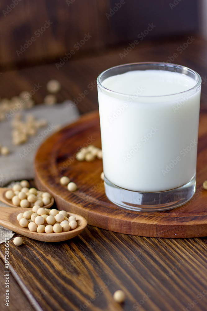 Soy milk with soy beans around it. Soy milk with soy beans around it.