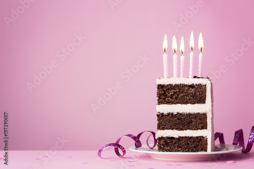 Chocolate birthday cake with pink candles