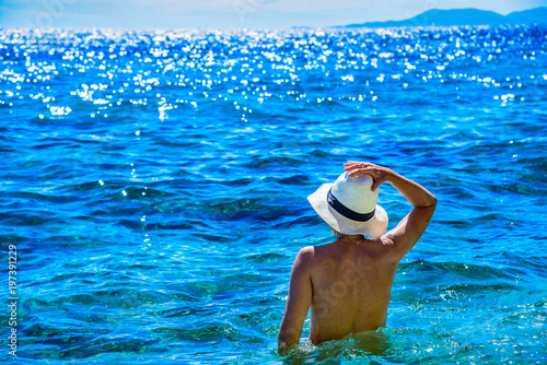 Fototapeta Naklejka Na Ścianę i Meble -  Beautiful landscape of Croatia see with naked women from back, Croatia coast, holidays. Panorama