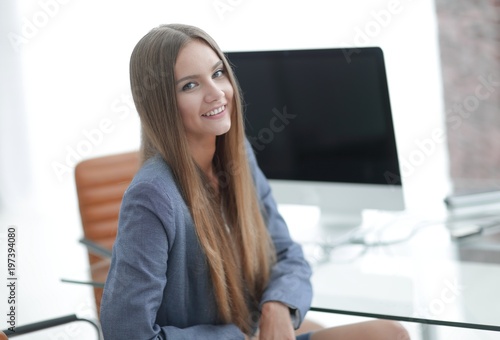 female office employee sitting at a Desk