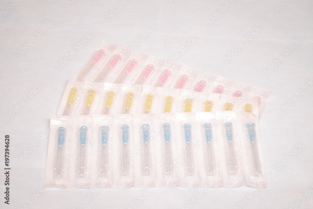 Unused medical needles in the package Unused medical needles in the package