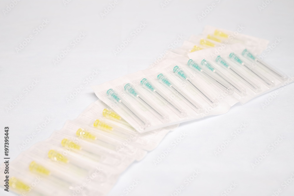Unused medical needles in the package Unused medical needles in the package